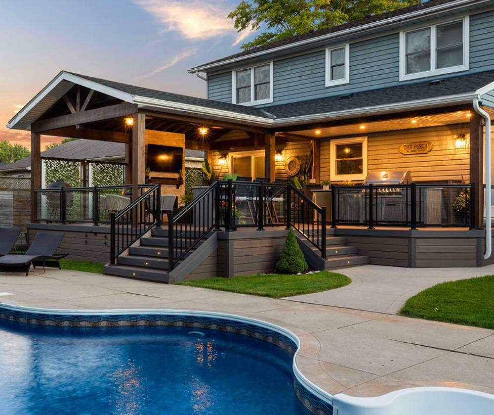 Covered poolside deck at dusk.