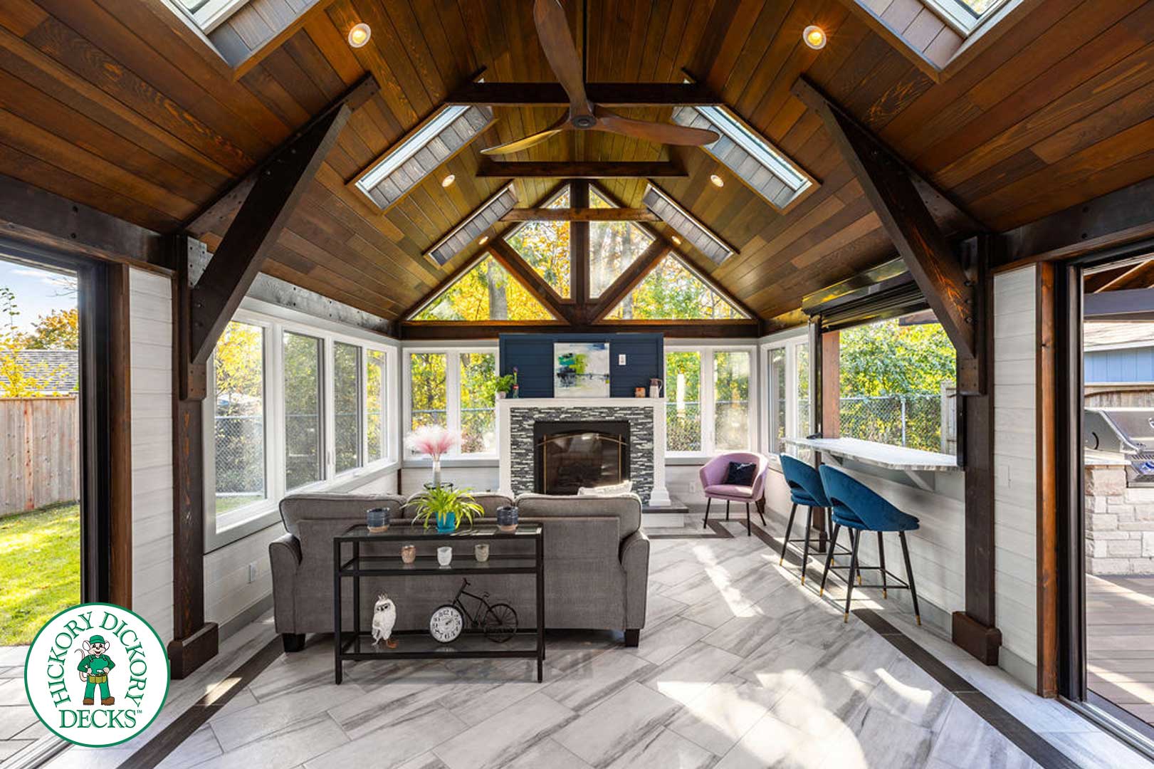 Sunroom with vaulted wood ceiling.