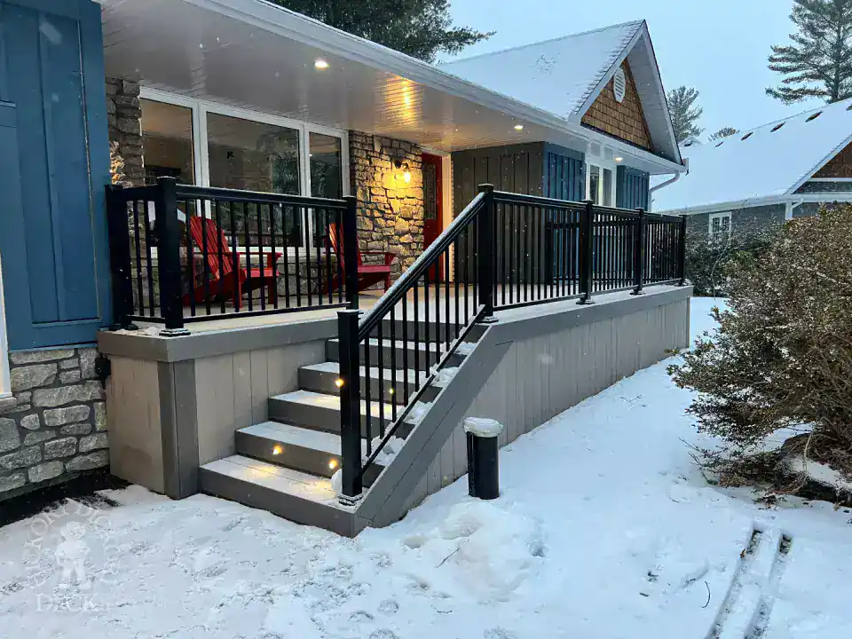 Deck with stairs and lights in snowy weather